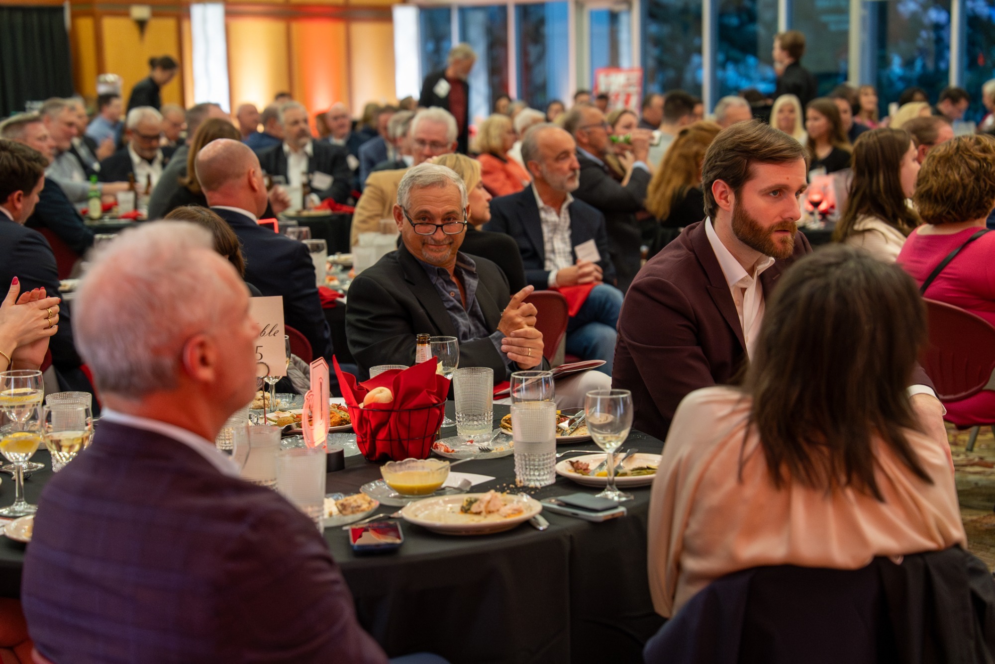 Attendees at the 2025 Hall of Fame ceremony listen to a speech 