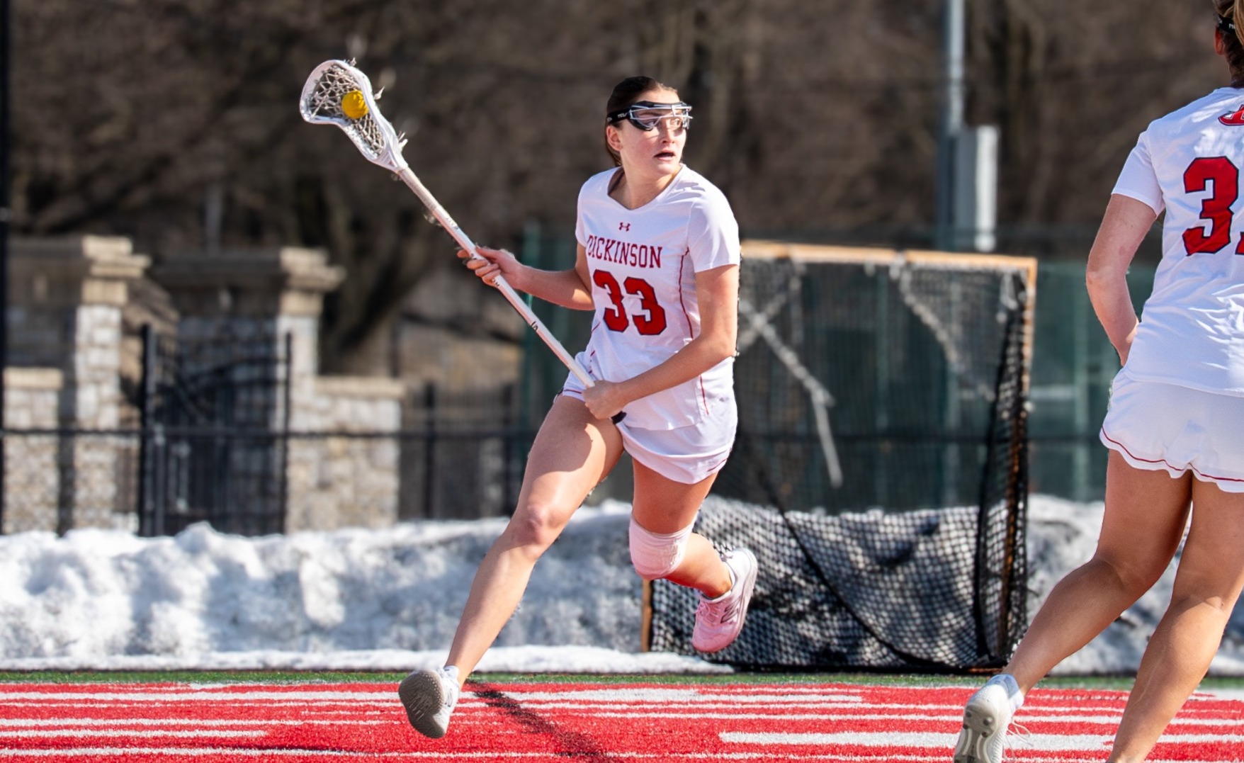 Sage Whiteside setting up the offense from behind the cage against Lebanon Valley College on 2-14-26