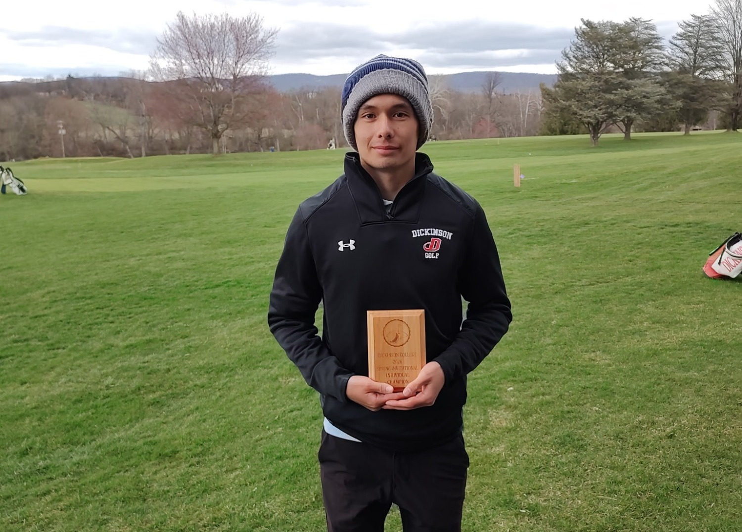 William Griffith with his championship plaque at the Dickinson Spring Invite on 3-24-26