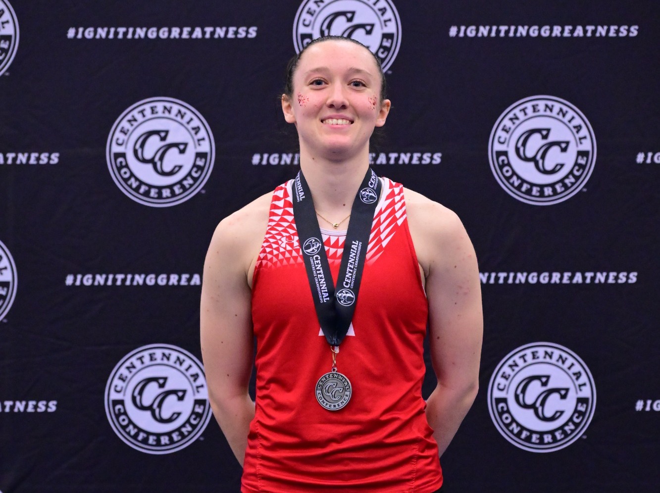 Erin Olsavsky on the podium at the 2026 CC Indoor Track & Field Champs