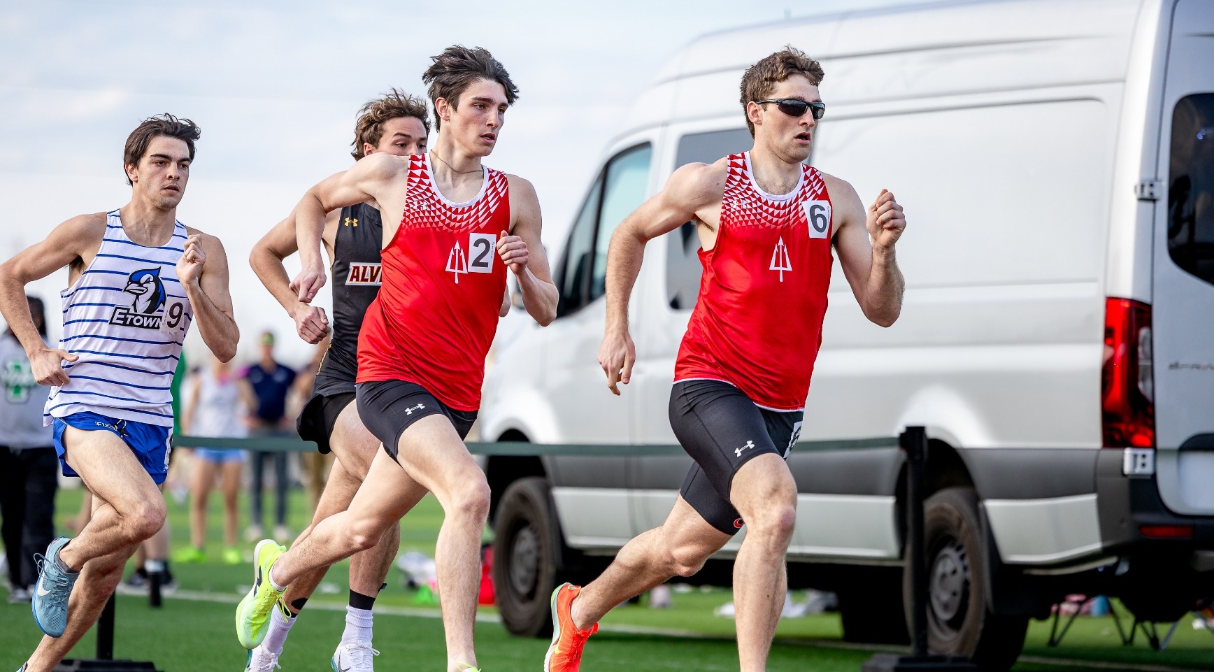 Two Red Devils run in a race