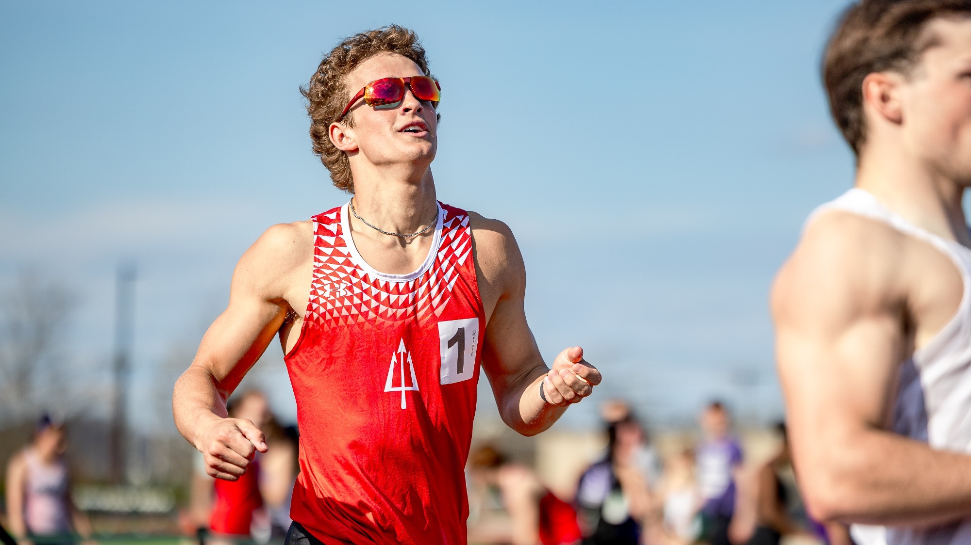 Owen Buroker crosses the finish line with a smile