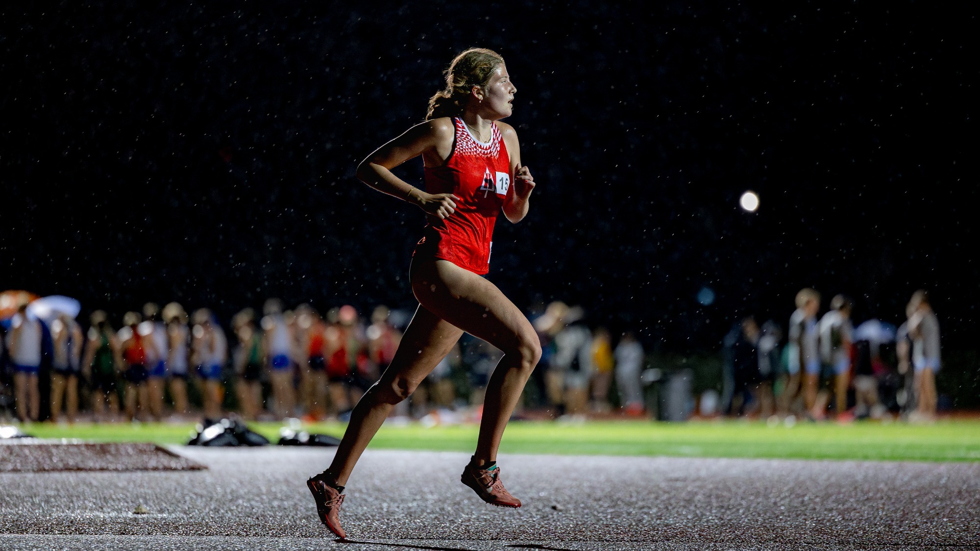Liza Barbash runs through the rain