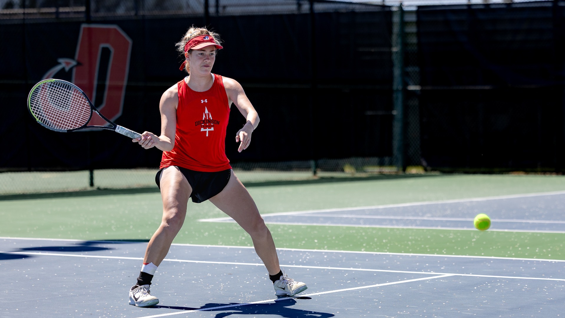 Women's tennis player readying for a shot during the 2025-2026 season
