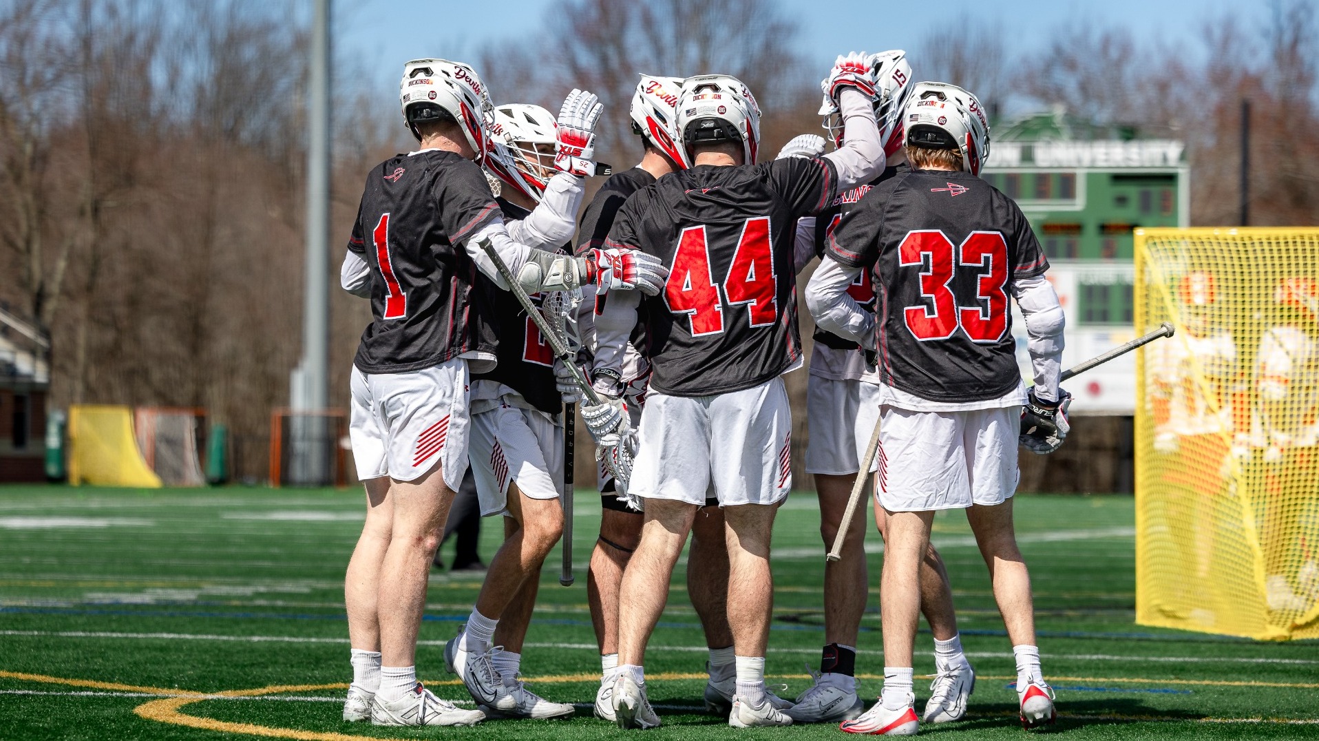 Men's lacrosse group goal celebration against Denison University on 3-14-26