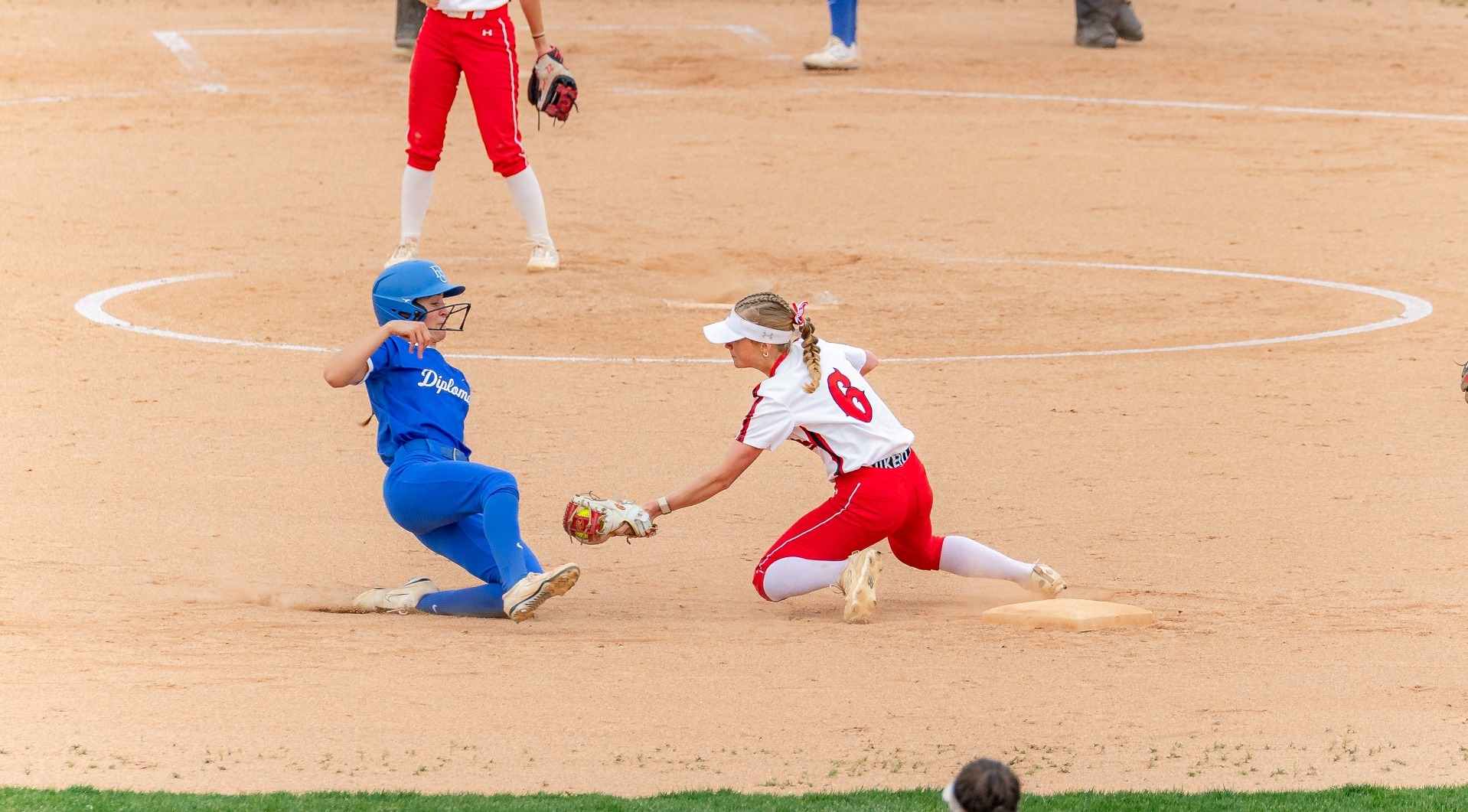 Erin Eltzholtz going for a tag on a Franklin & Marshall runner trying to swipe second base on 4-18-26