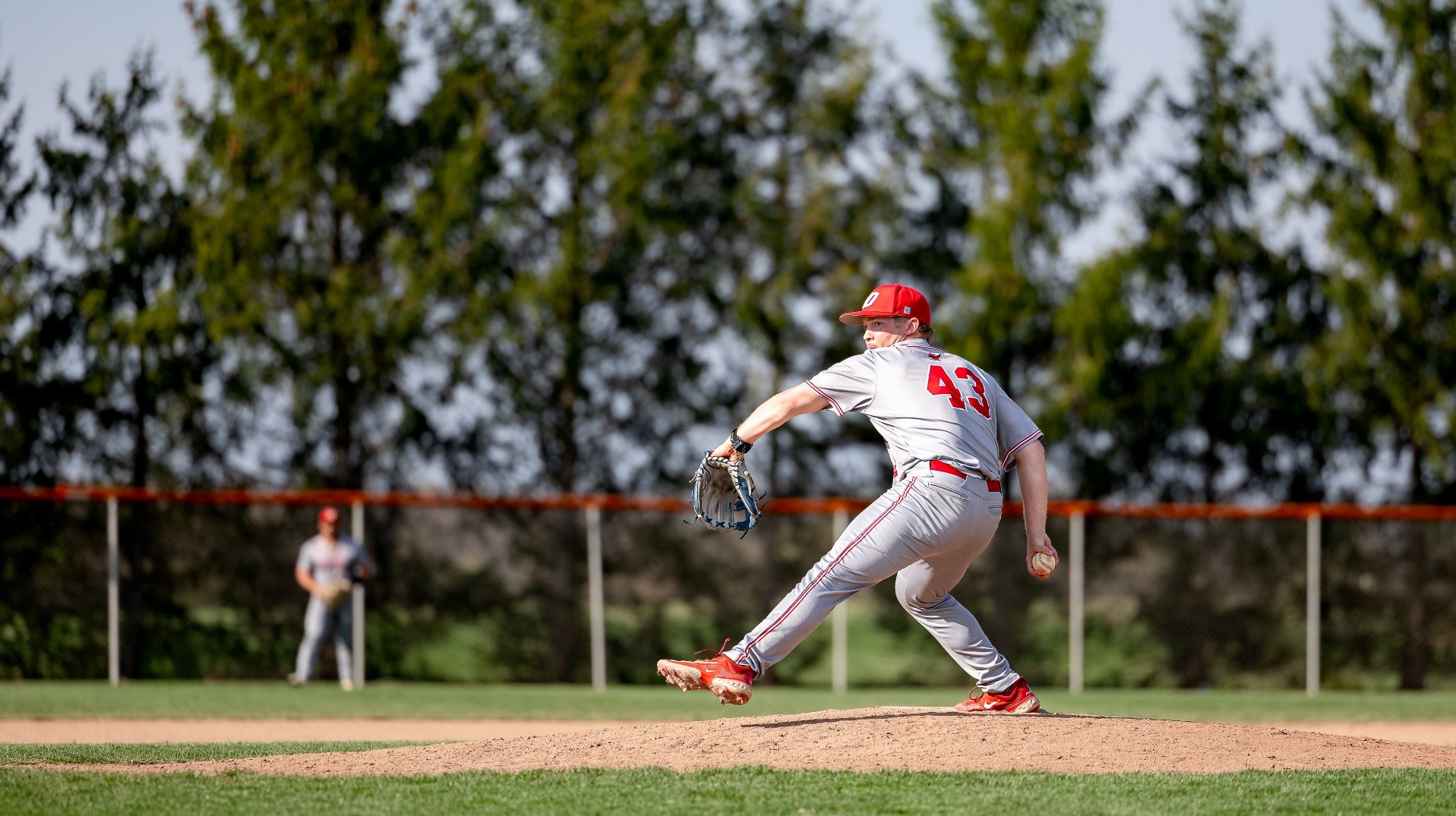 Zander Leckzsas making a pitch against Gettysburg College on the road during the 2026 season