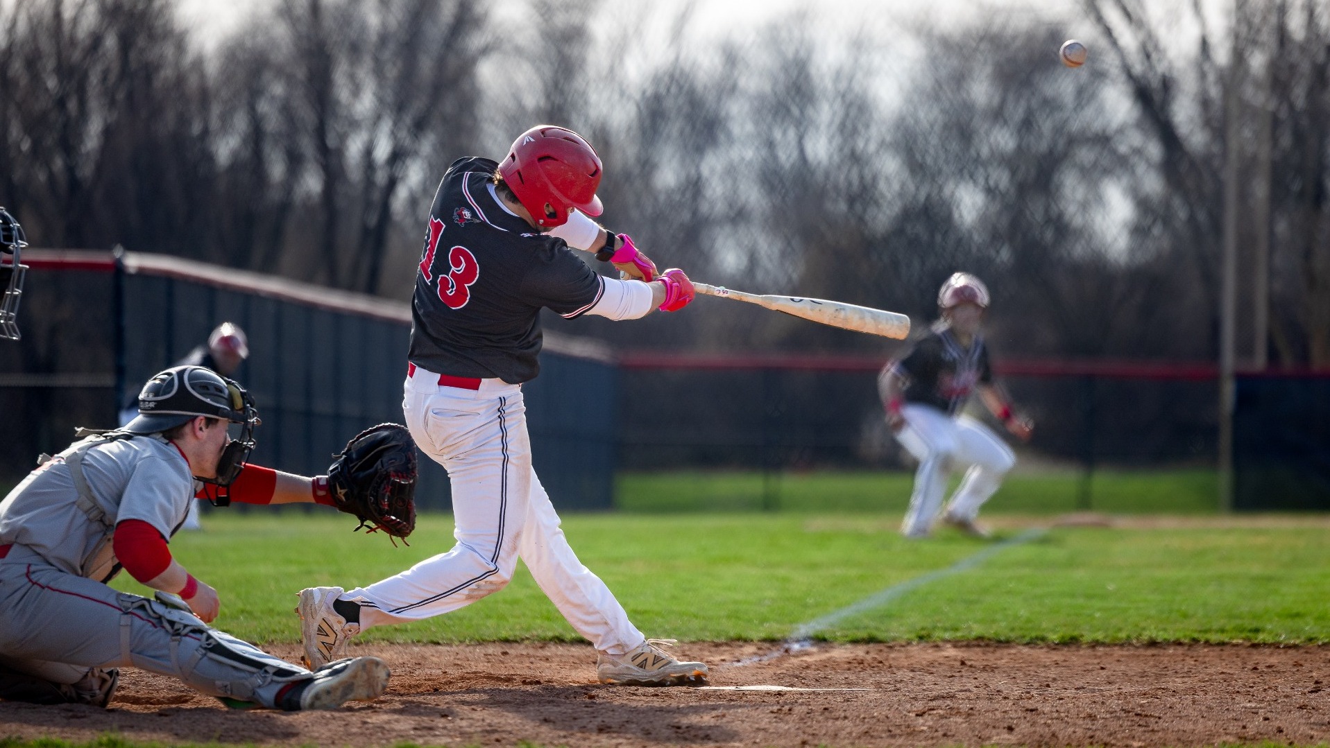 Miguel Reich taking a swing against Saint Lawrence University during the 2026 season