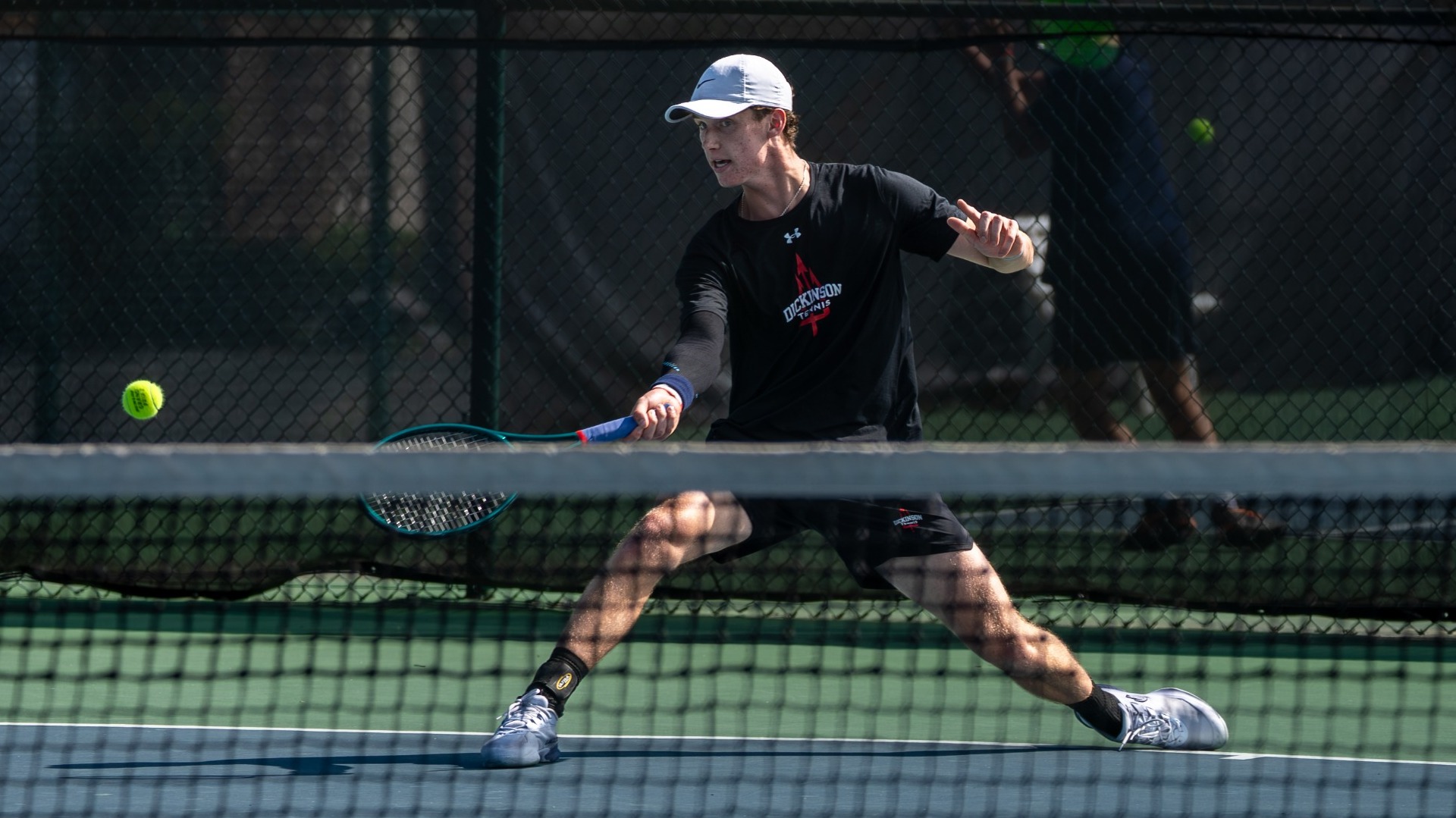 Lucas Bogle going for a forehand shot against Gettysburg College during the 2026 season
