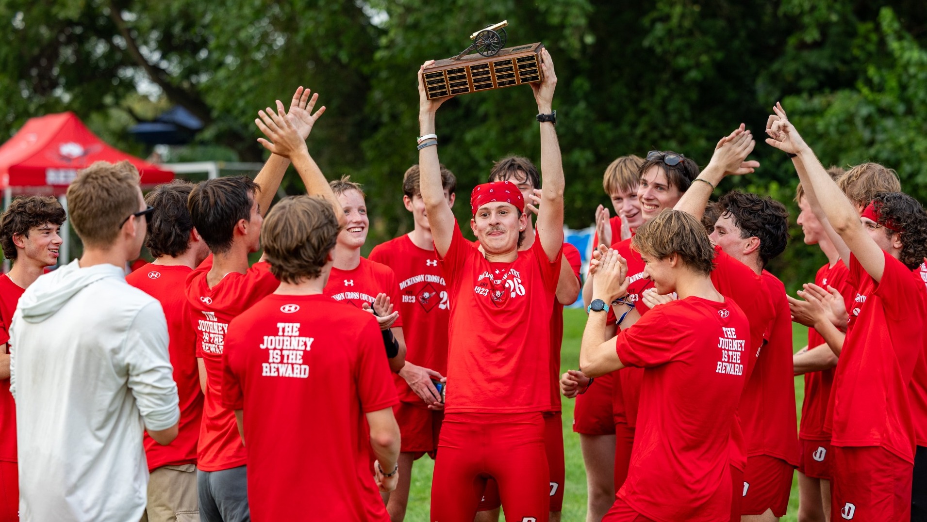 2026 Men's cross country team celebrating their 29th-straight Little Three Championship title 9-1-26
