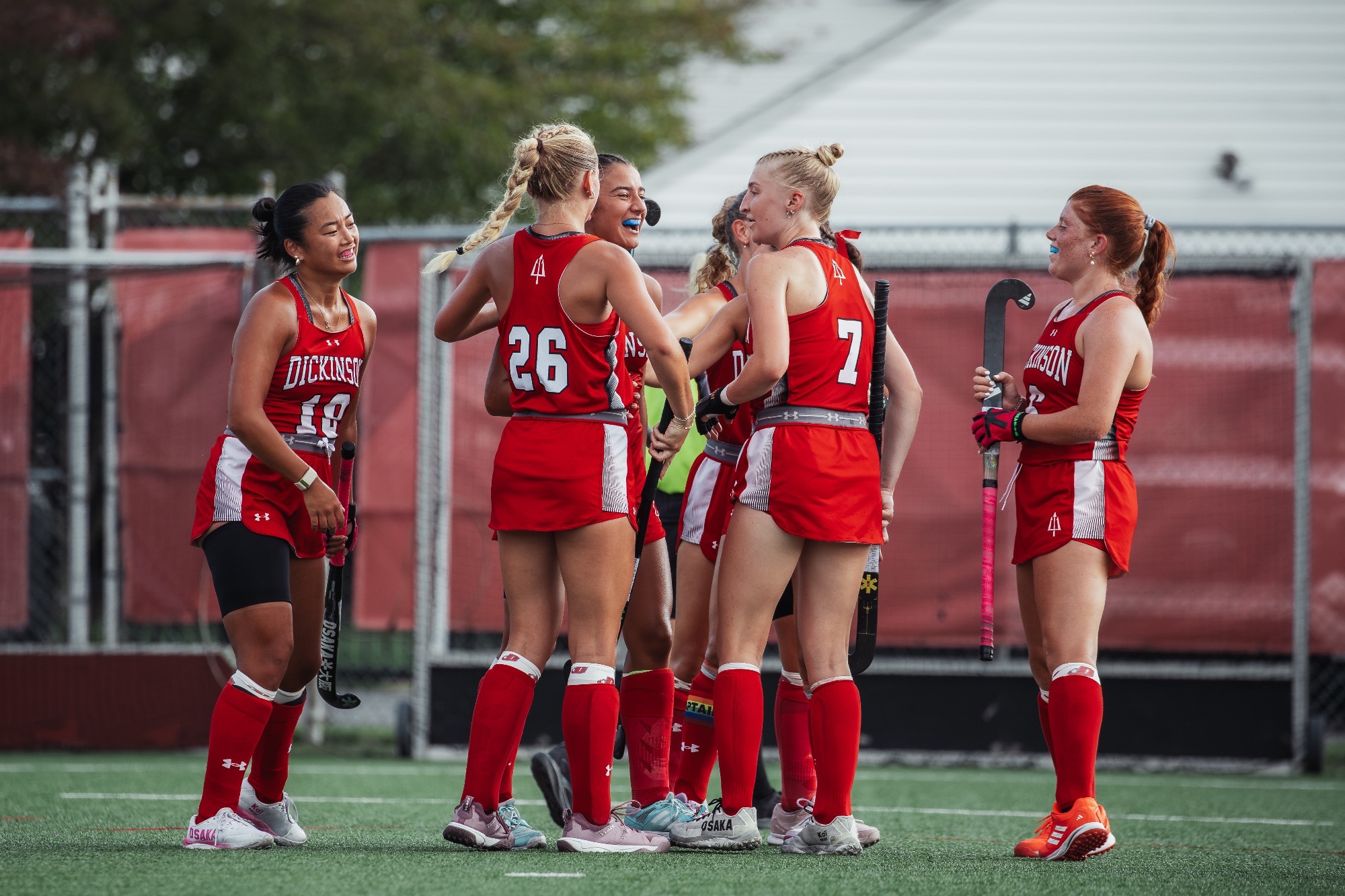 Dickinson Field Hockey team celebrates following a goal scored by Alex Hackett