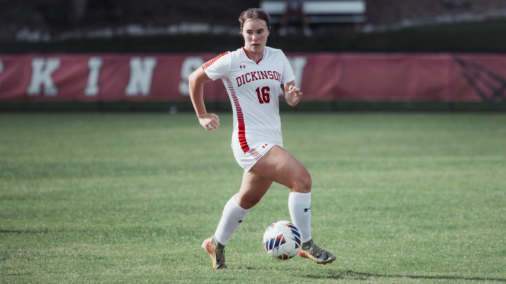 Mckenna Gross bringing down a pass against Waynesburg University on 9-4-26