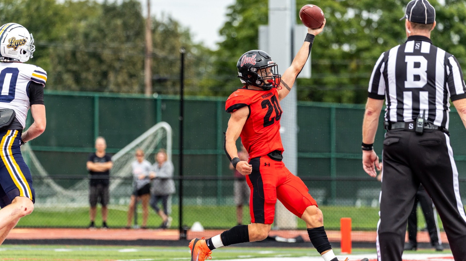 Dane Sorensen celebrating as he runs into the endzone against Lycoming College on 9-19-26