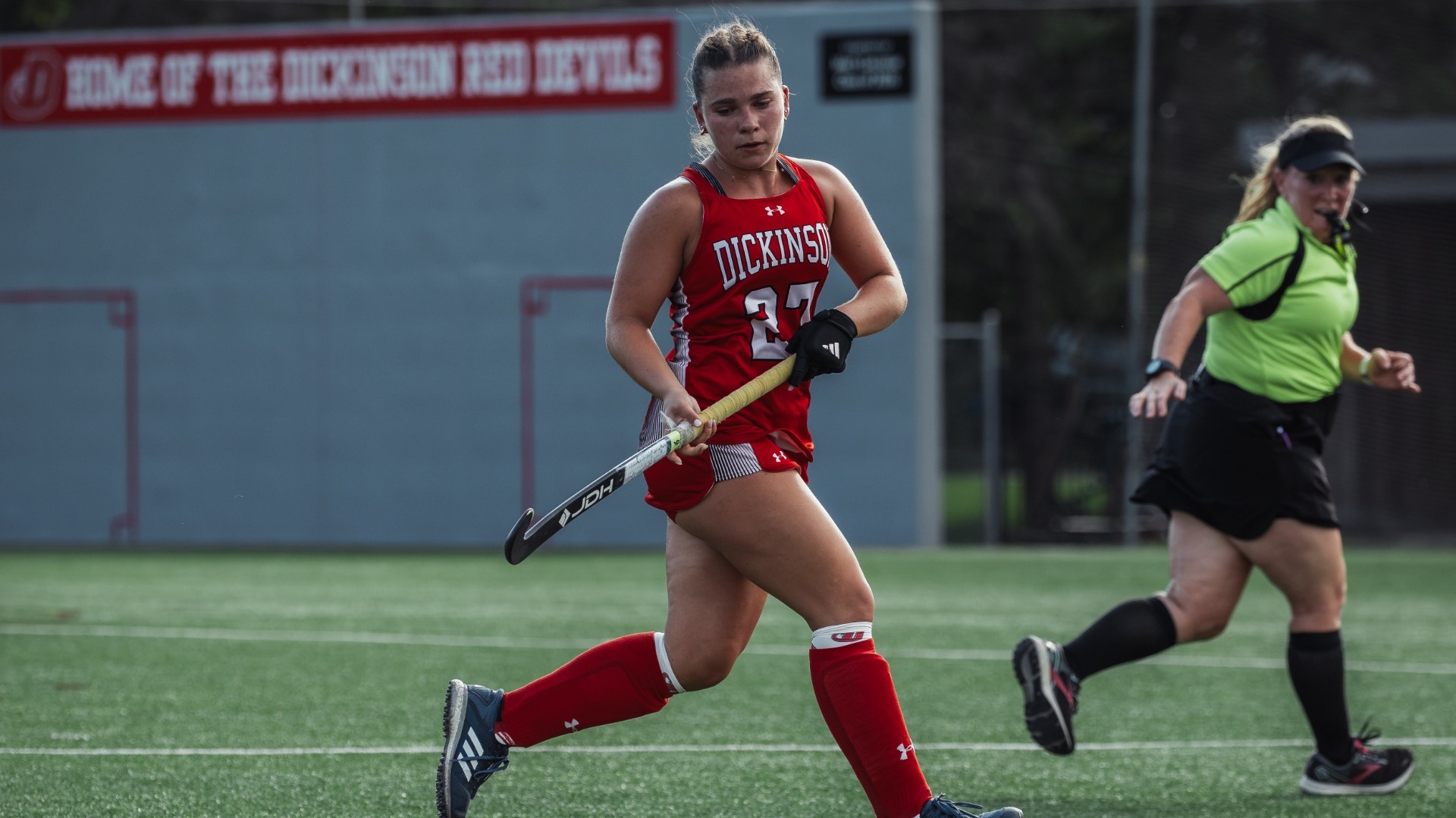 Ella Ledenko chasing down a ball against Susquehanna University on 9-9-26