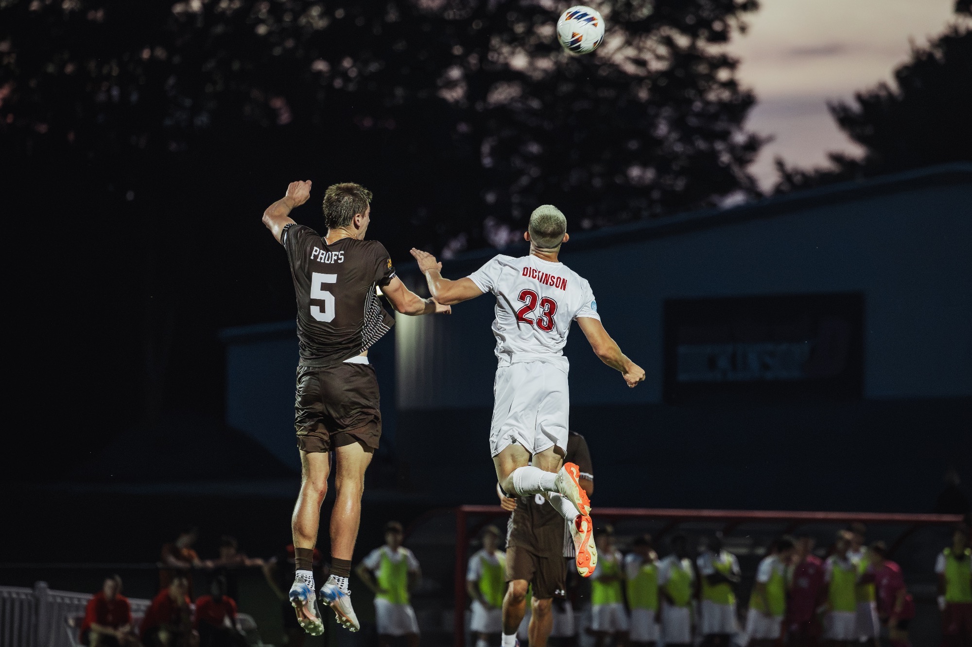 Darian Crim goes for a header against Rowan