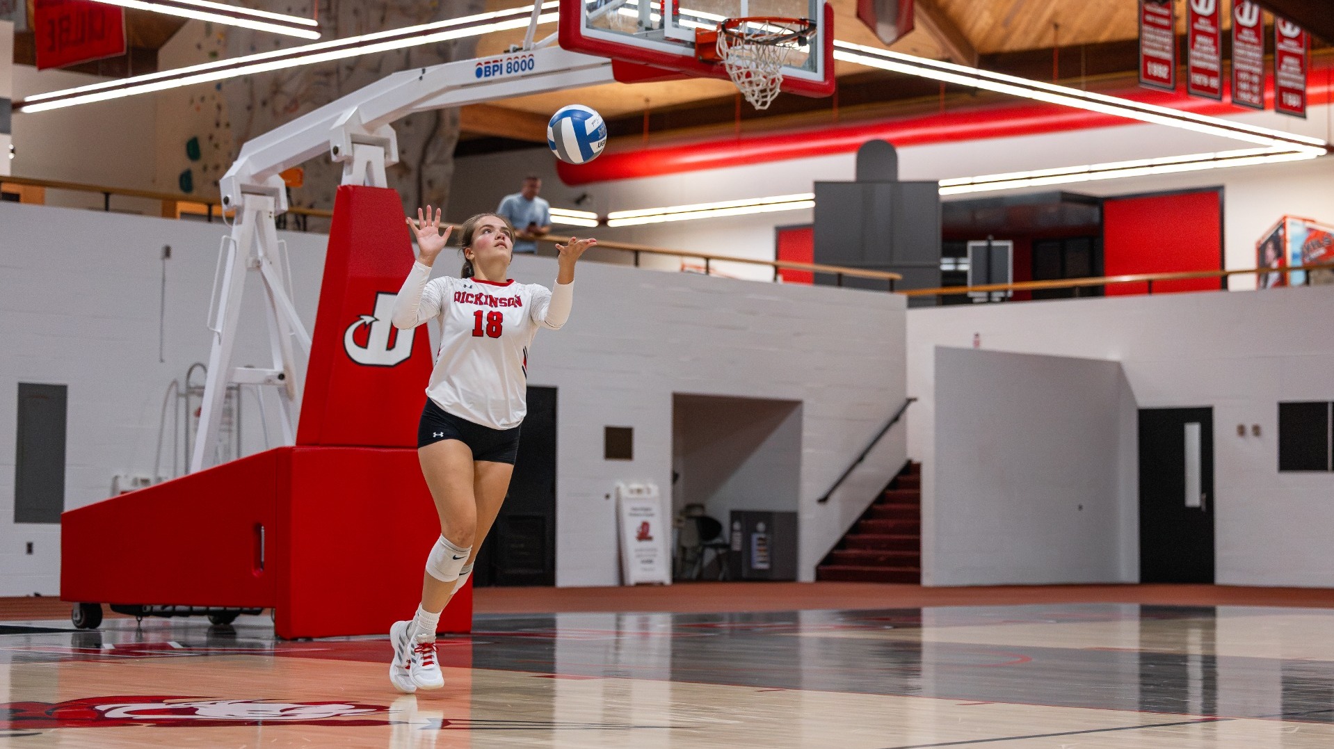 Brenna Williams getting ready to serve against Catholic University on 9-12-26