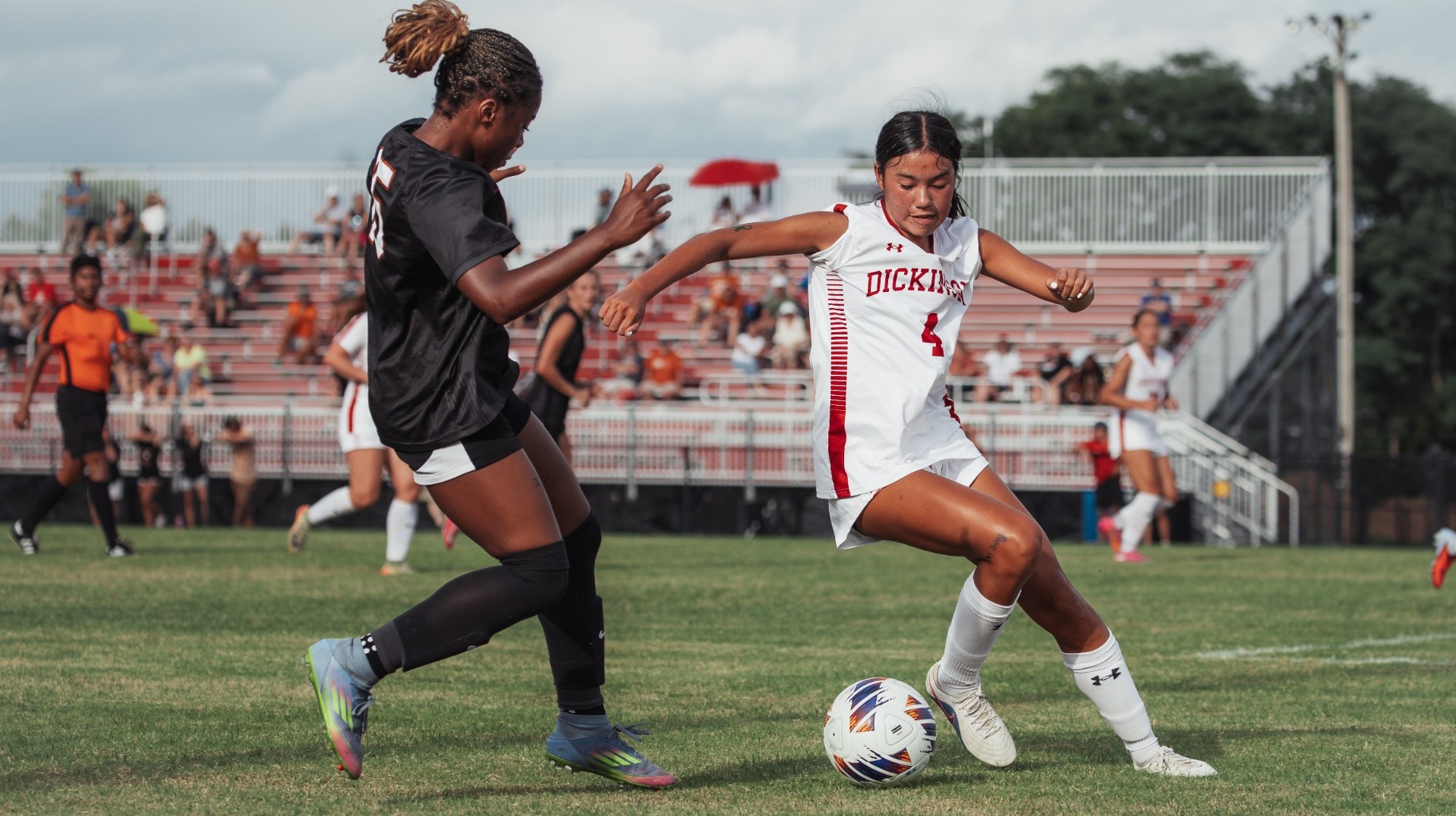 Megan Lomotan protecting the ball against Waynesburg University on 9-4-26