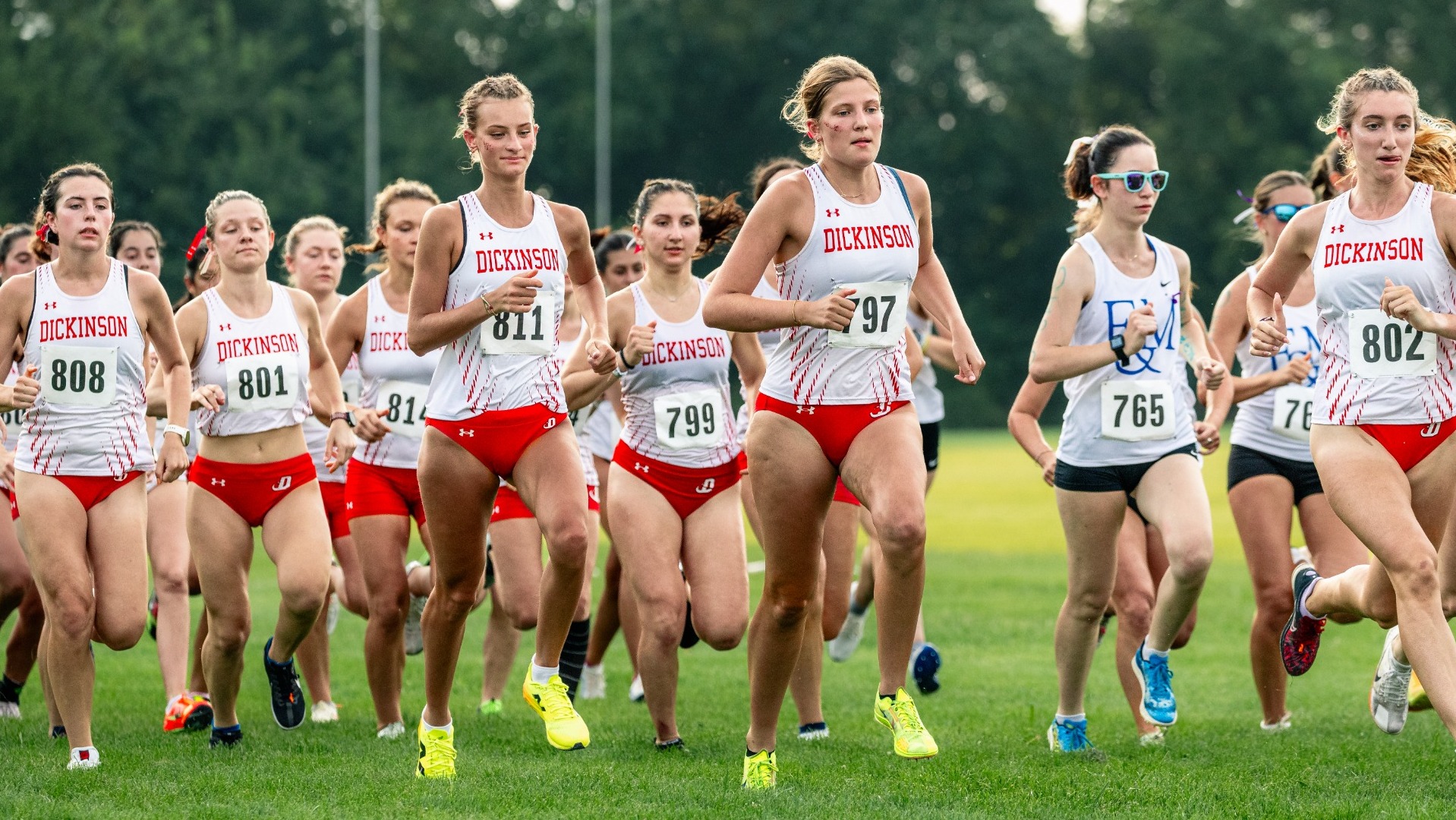 Group of women's cross country runners at the starting line of the Little Three Championship on 9-1-26