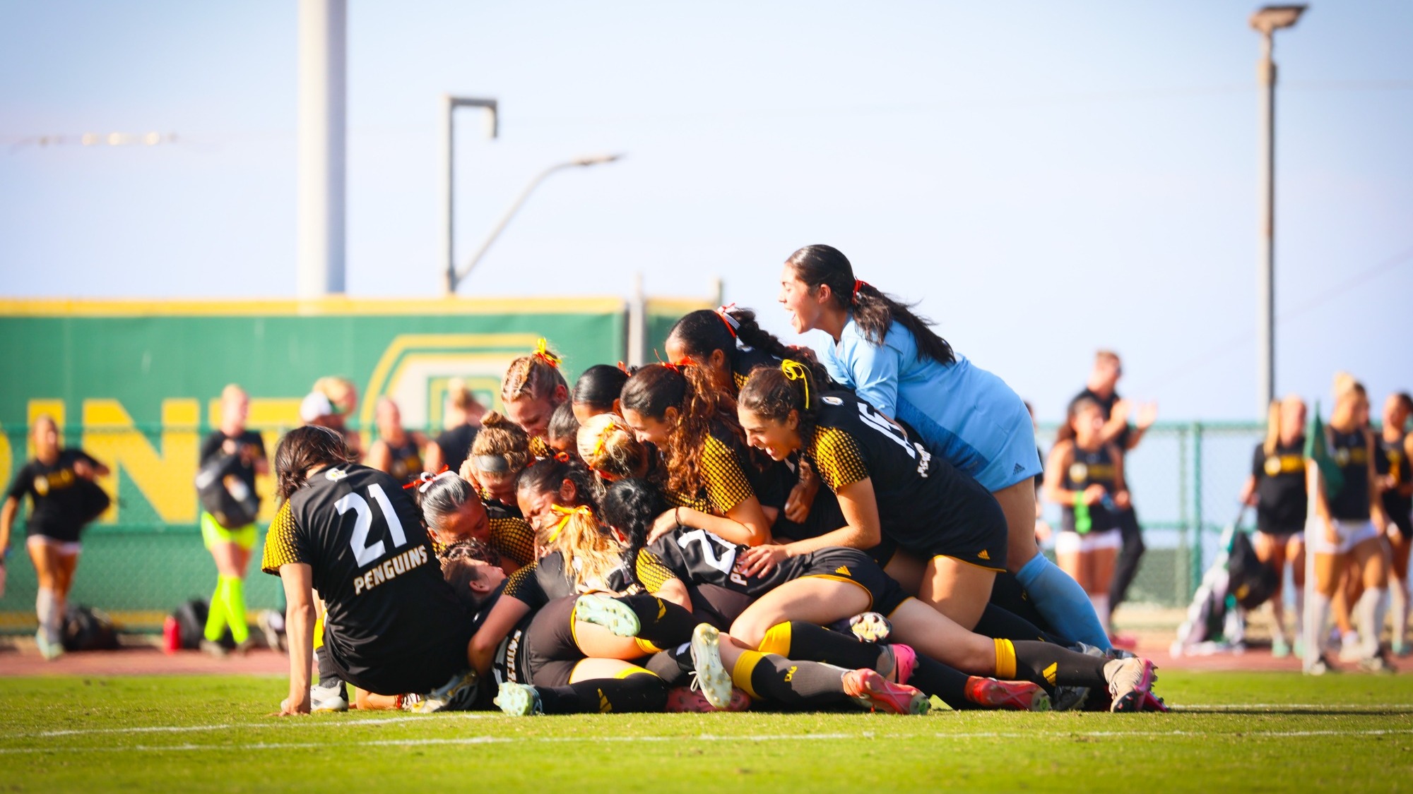 Dominican celebrates its penalty shootout victory over top seeded APU