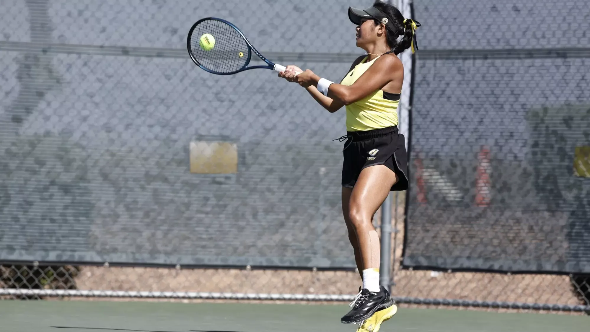 Audrey Rafols with a forehand return in doubles play at the PacWest Championships