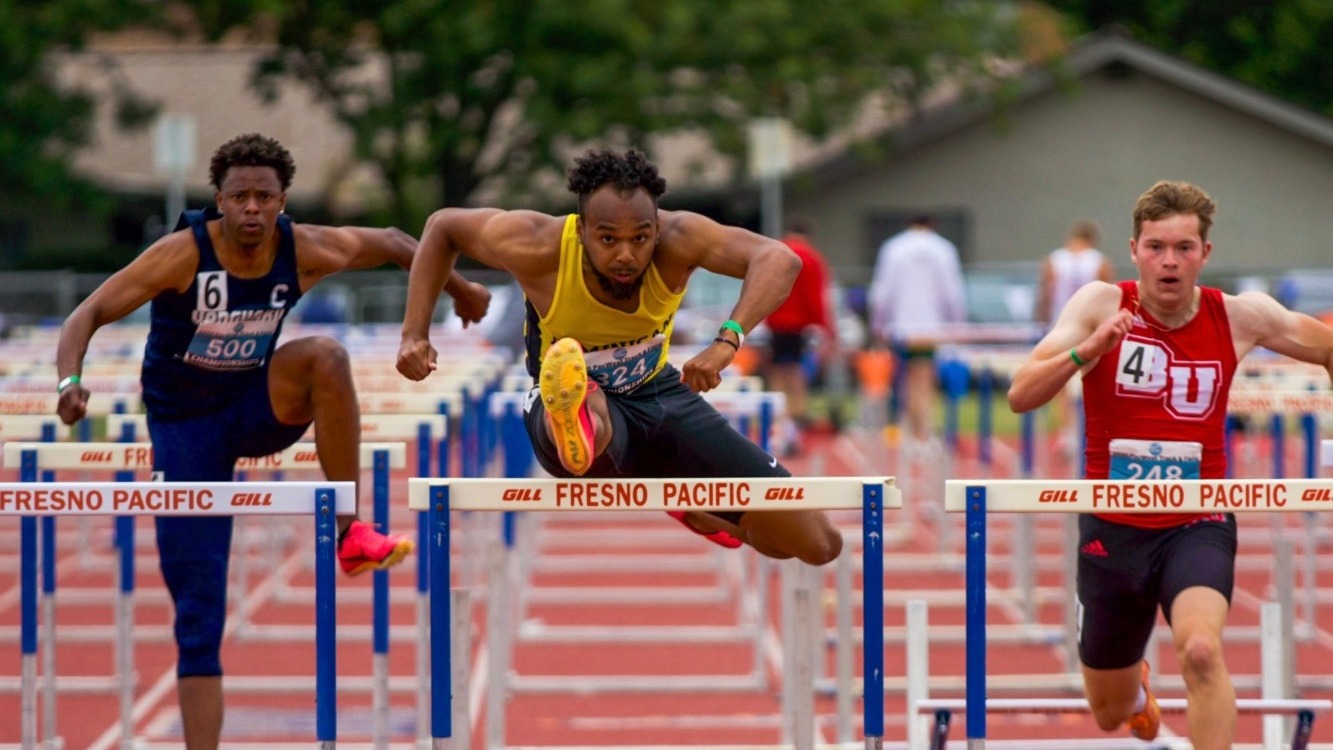 Adrian Aguirre leads the pack on the way to his second PacWest 110H Title