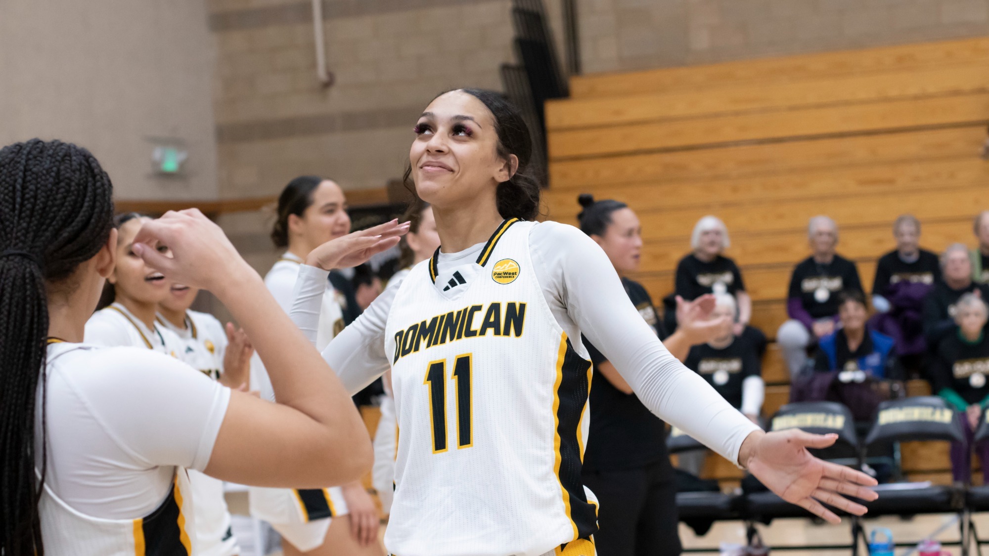 Keyonee Neal greets teammate during pregame lineups