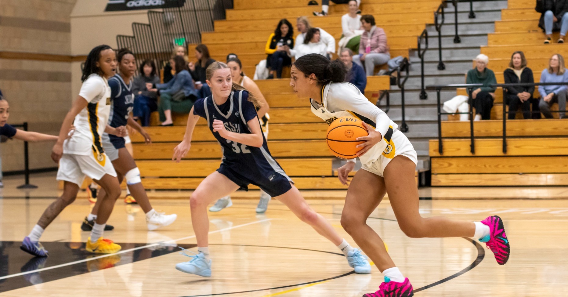 Keyonee Neal begins a drive to the hoop
