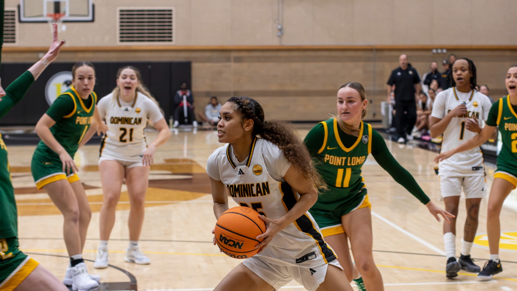 Janiya Sawyer drives to the basket against PLNU