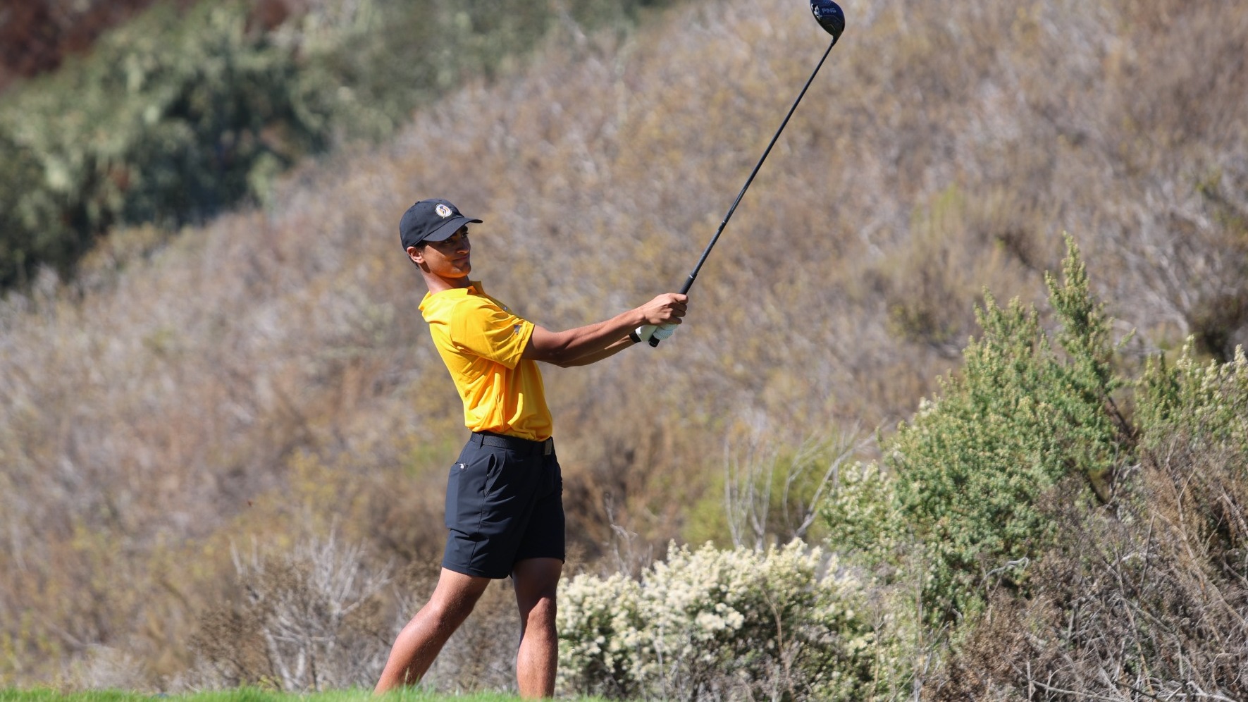 Ayden Stack watches his drive at the RCA Men's Invitational