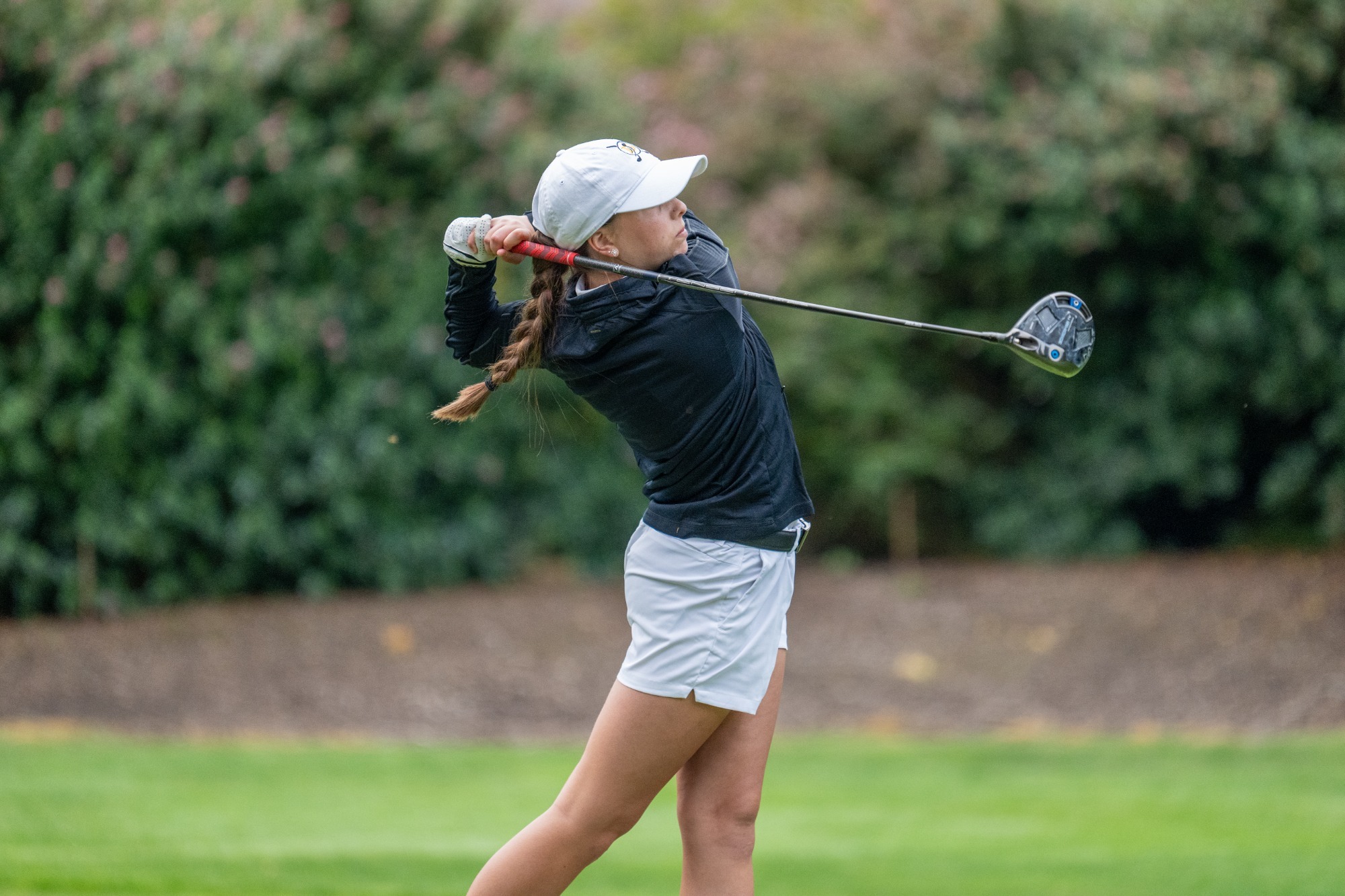 Madi Whitney drives the ball