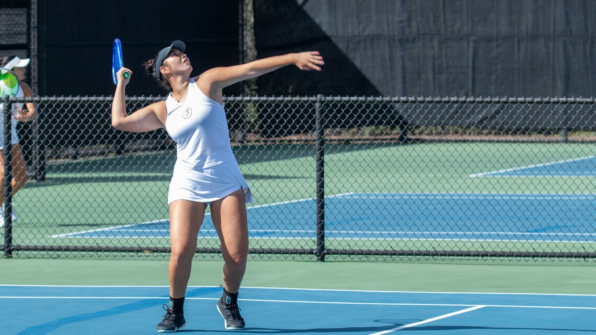 Kaylee Lopez prepares for an overhead return