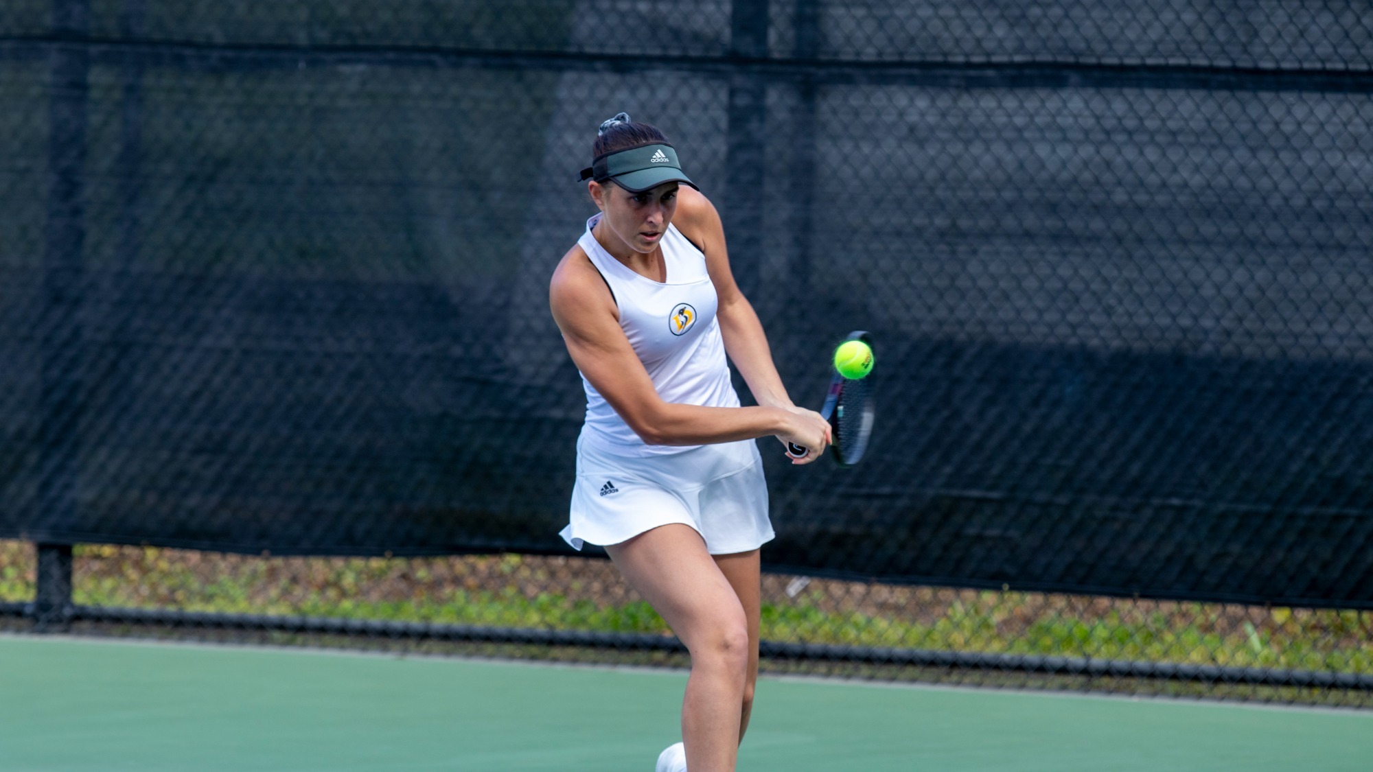 Maria Gavrilov returns a ball against Fresno Pacific
