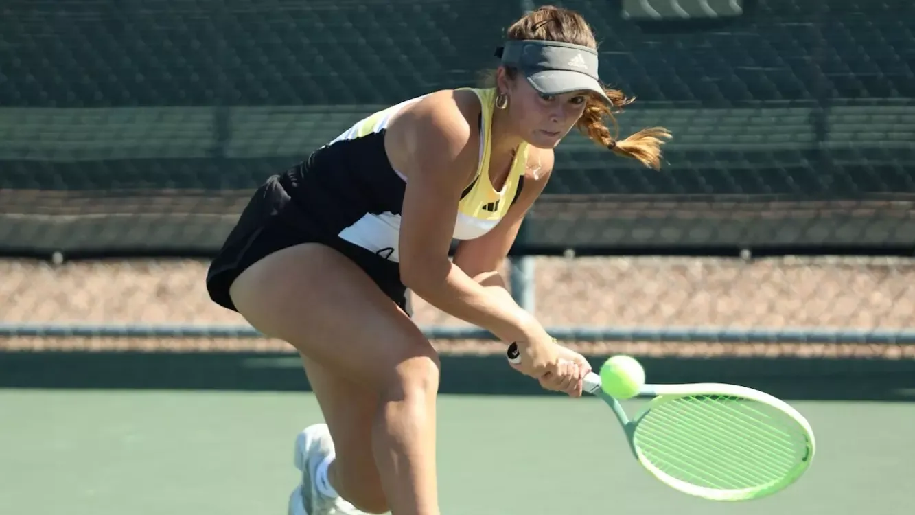 Sofia Acuña with a return against HPU at the PacWest Championships