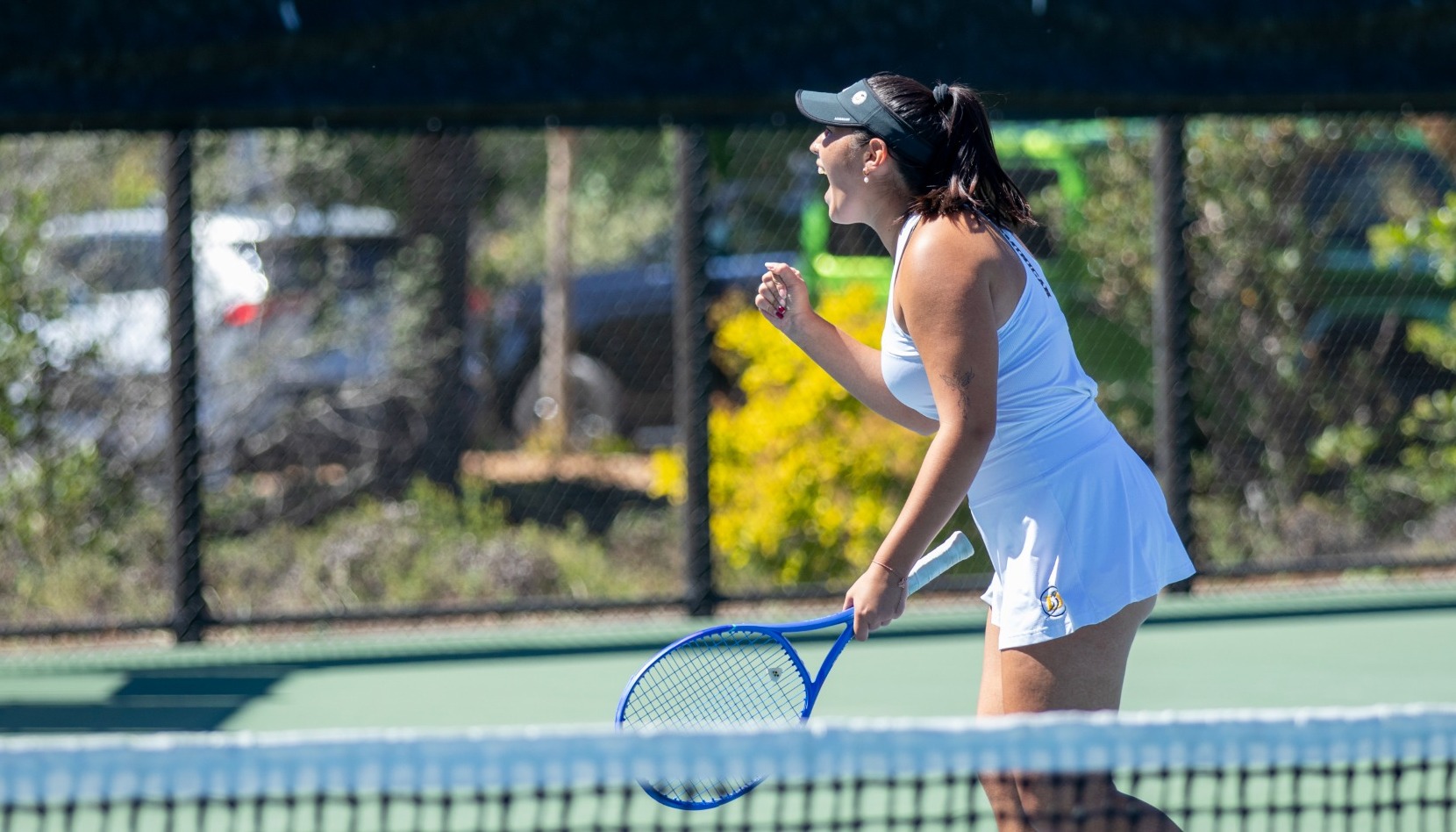 Kaylee Lopez celebrates a point in doubles against Westmont