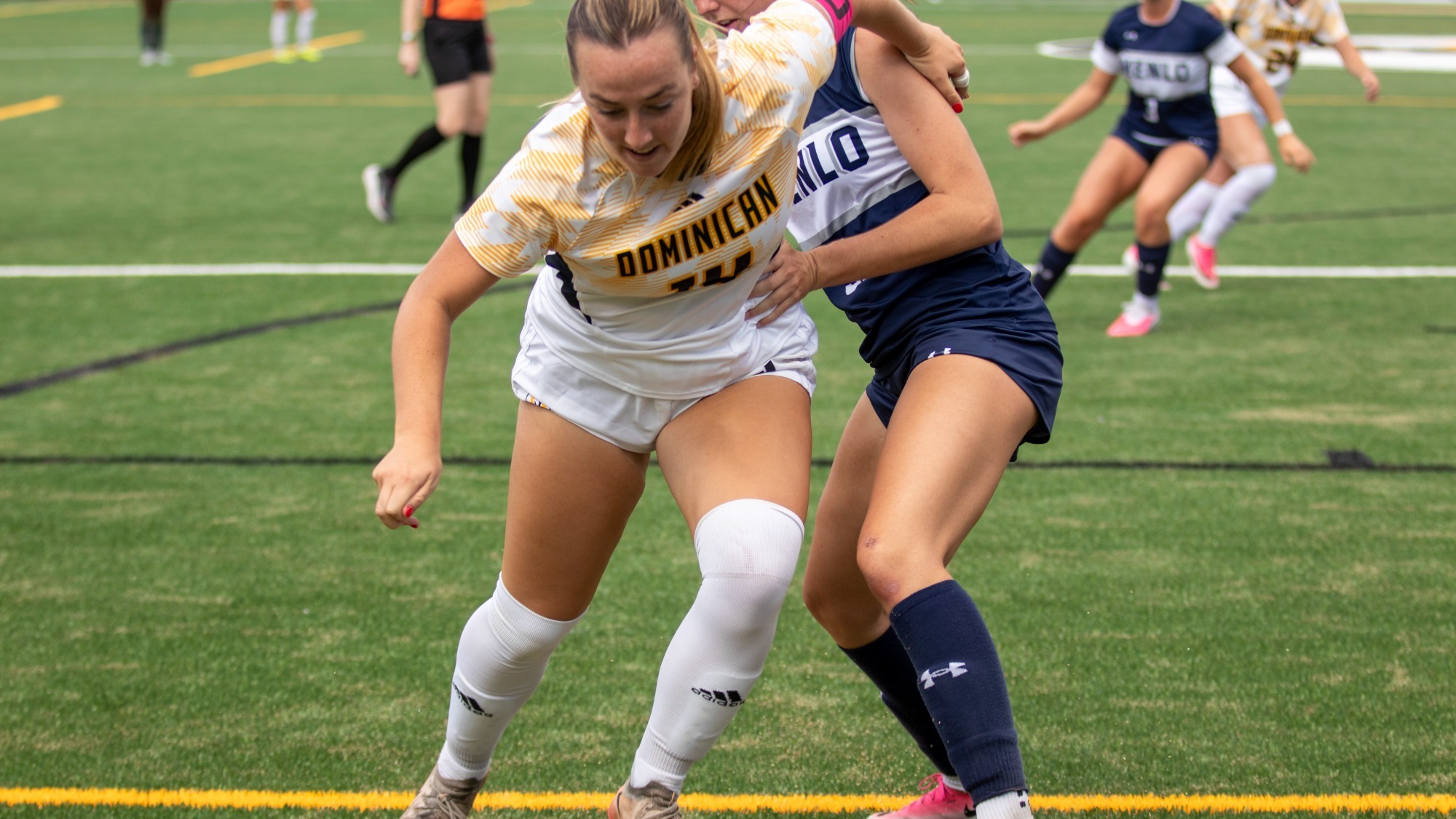 Janae Schwan pushes towards goal against Menlo