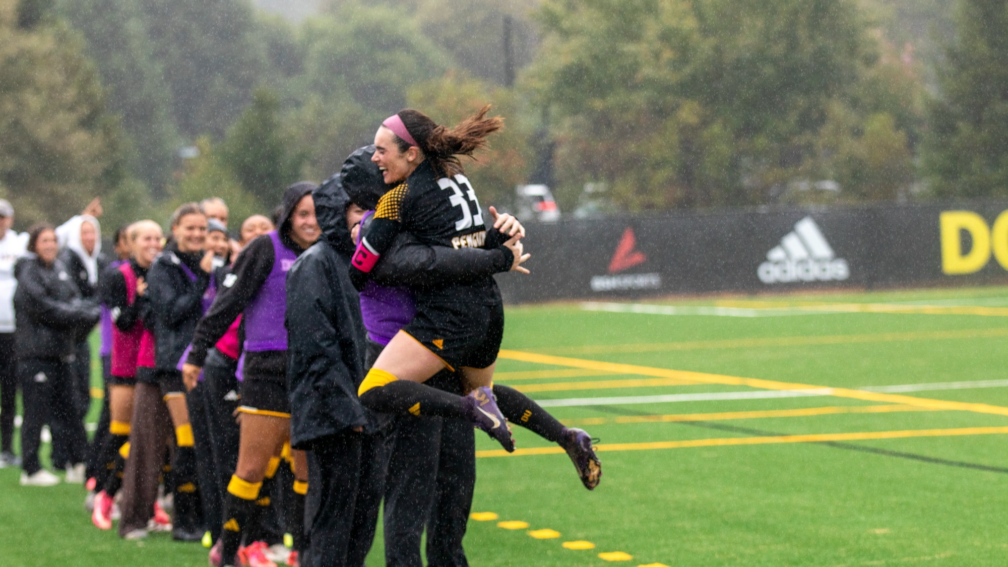 Carson Warfield celebrates her first goal of 2026 with teammates
