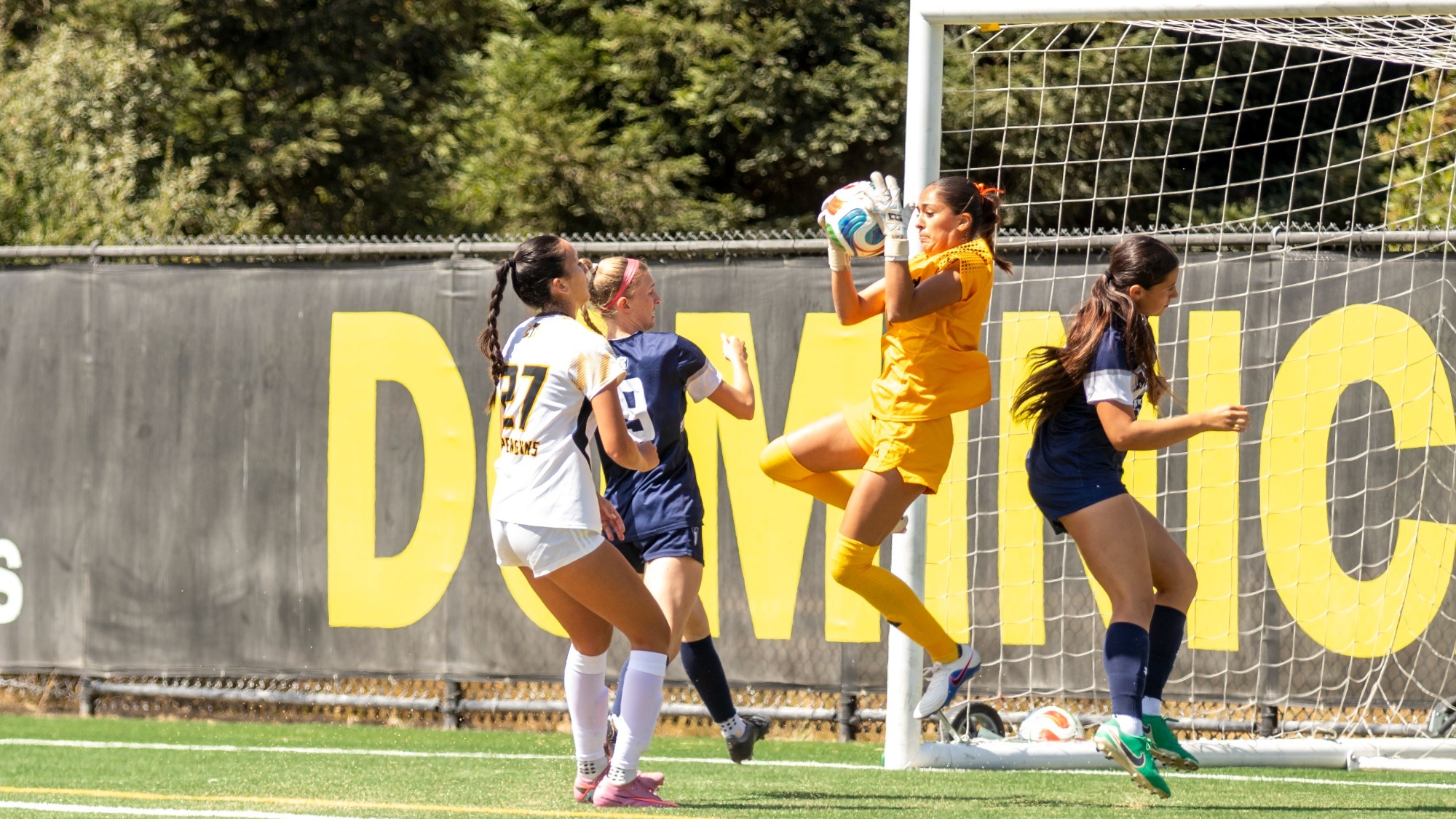 Michelle Salas Viniegra secures a save against Menlo