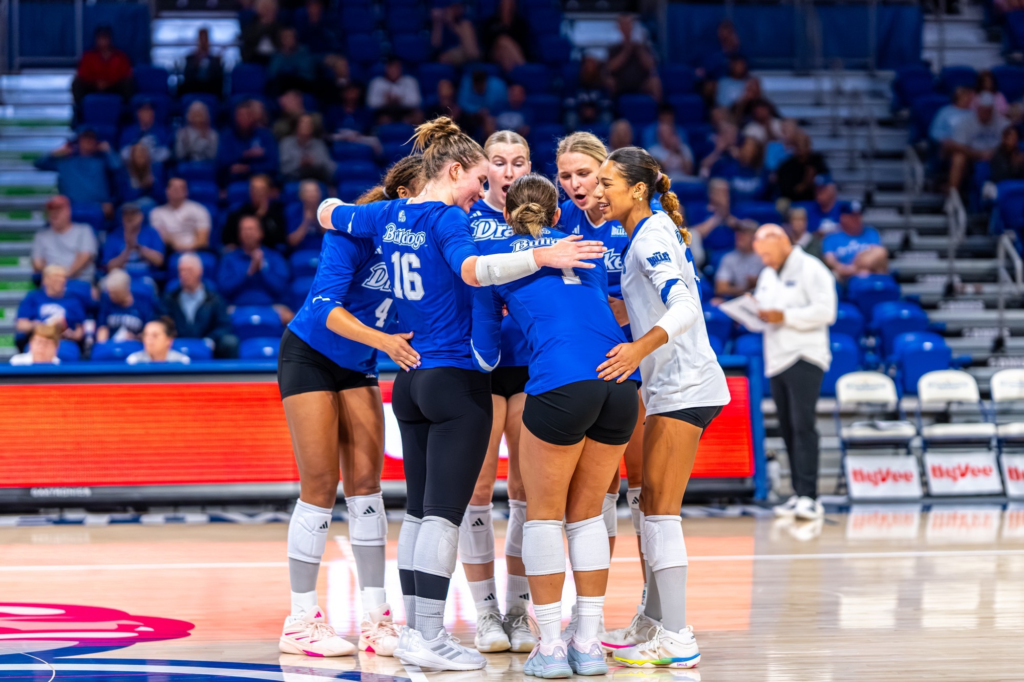 vball blue jersey huddle