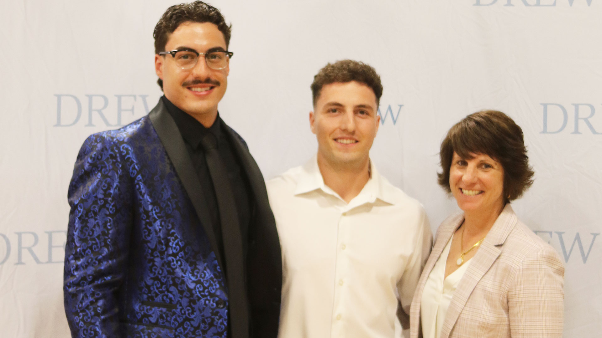 Male Career Athlete of the Year Mike DeMayo (center), presenter C.J. Addeo (left), and Director of Athletics Christa Racine