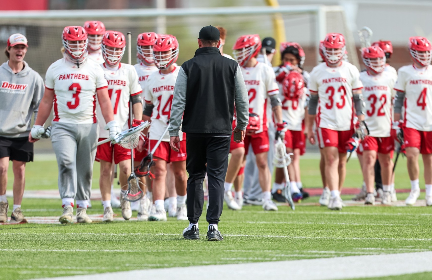 The Team Greets Coach Rich After A Game | Drury University Men's Lacrosse