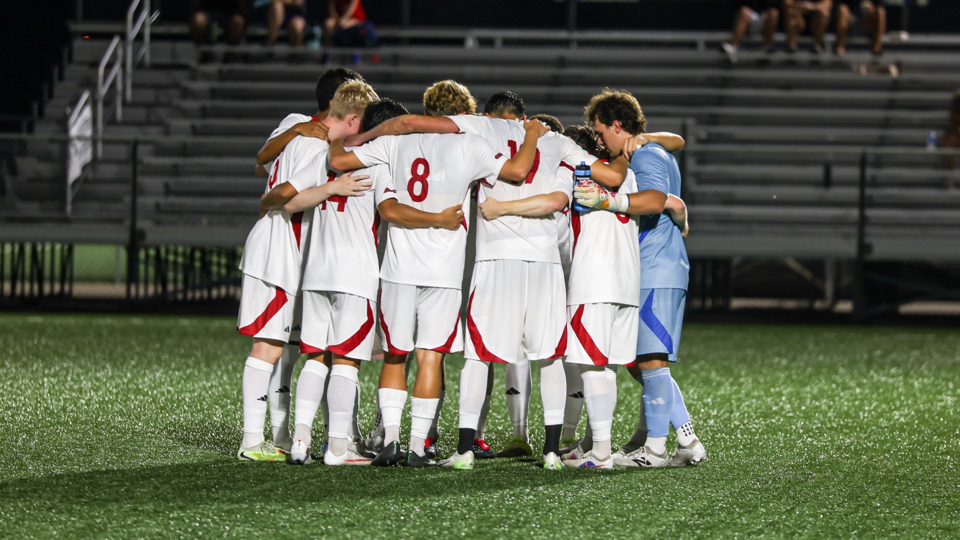 men's soccer starting huddle