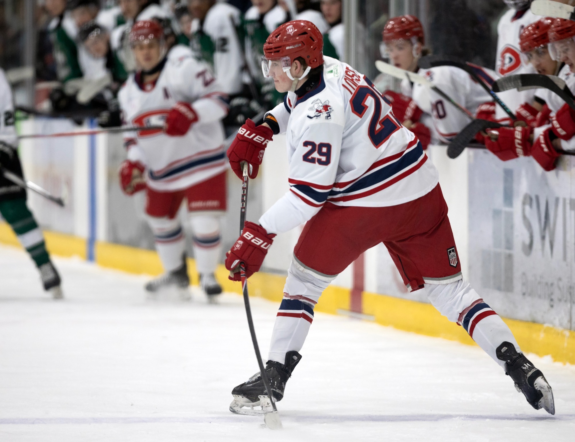 Hudson Lohse passes puck against Cedar Rapids