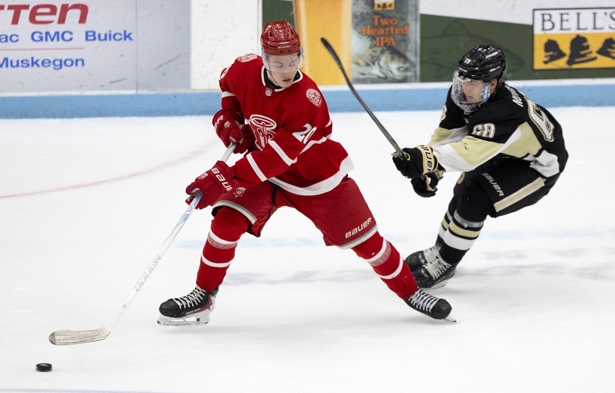 Gavin Lock holds puck in ECSF Game 4 vs Muskegon