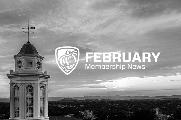 February Membership News text with campus image in background (in black and white)