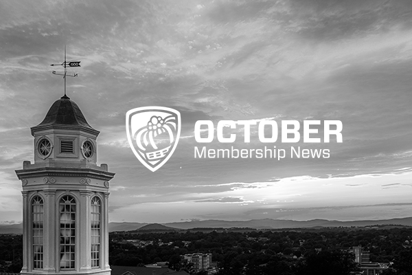 October Membership News text with campus image in background (in black and white)