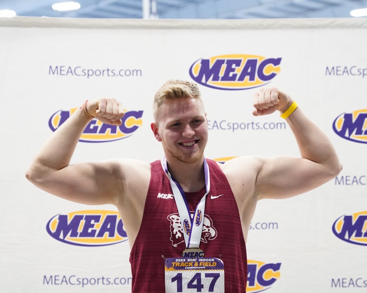 James Perkins celebrates winning the 2023 indoor weight throw