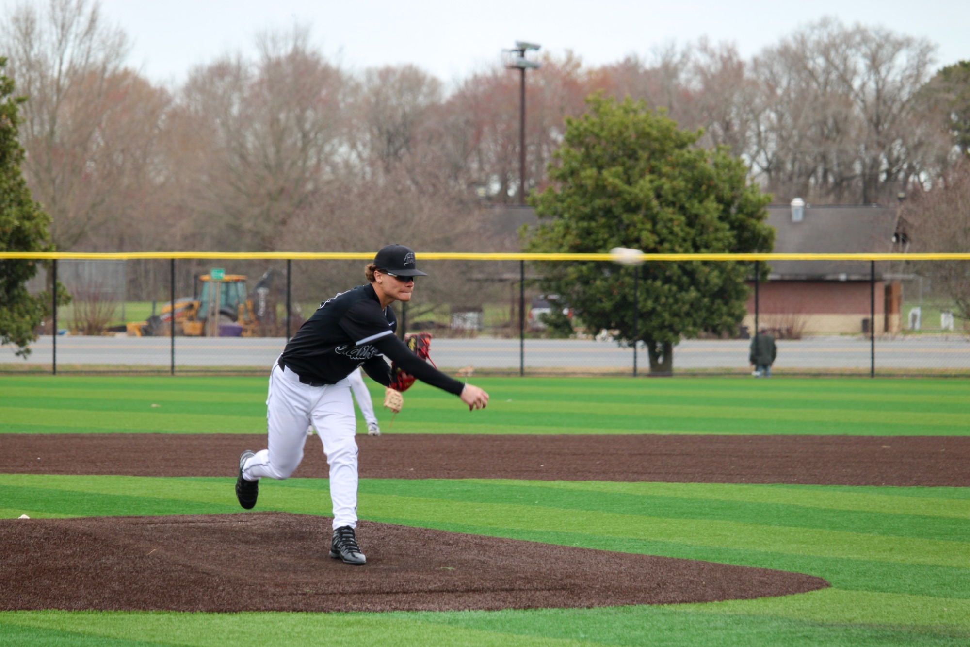 Richard De Jesus fires a pitch against Stonehill