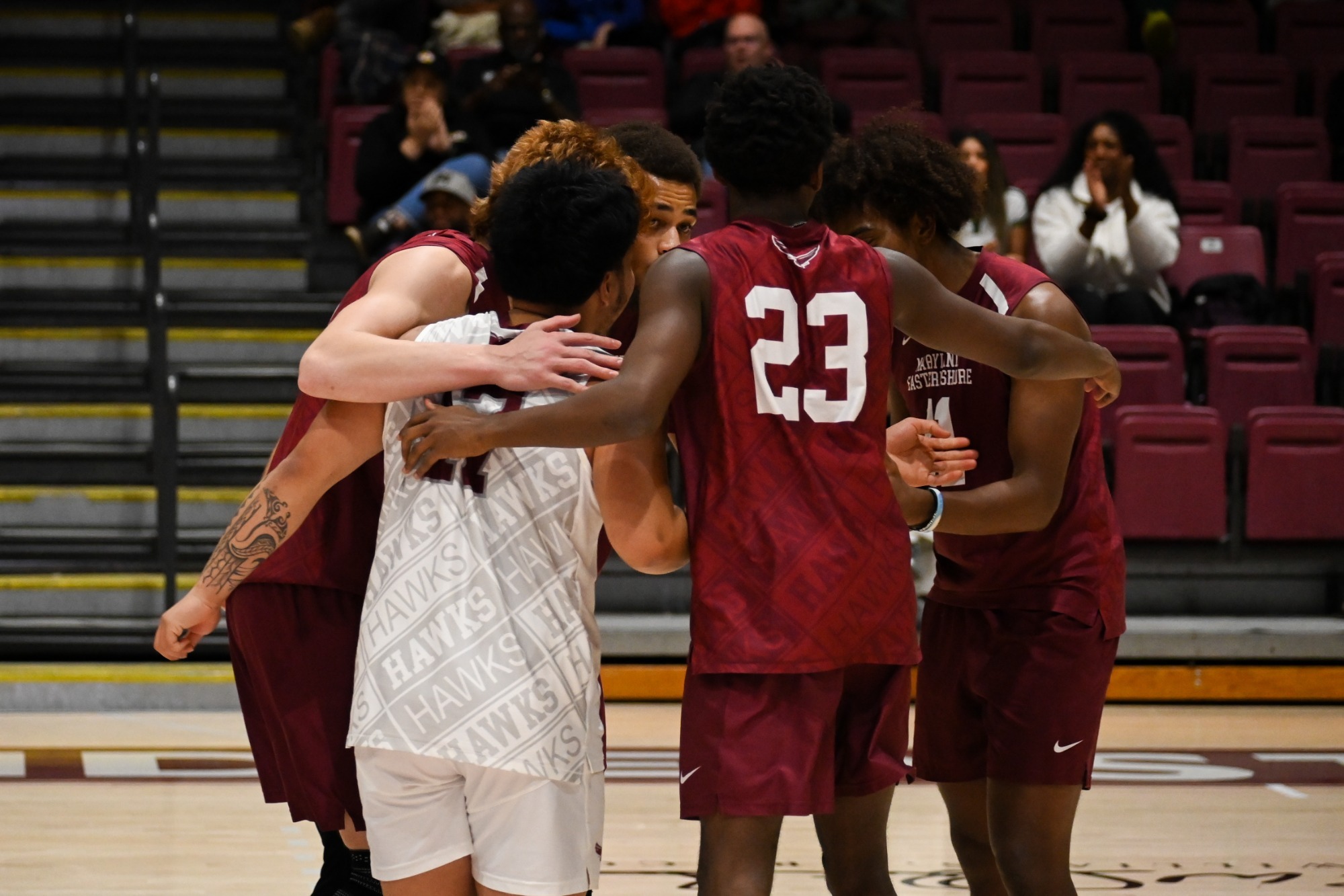 Men's volleyball team huddle