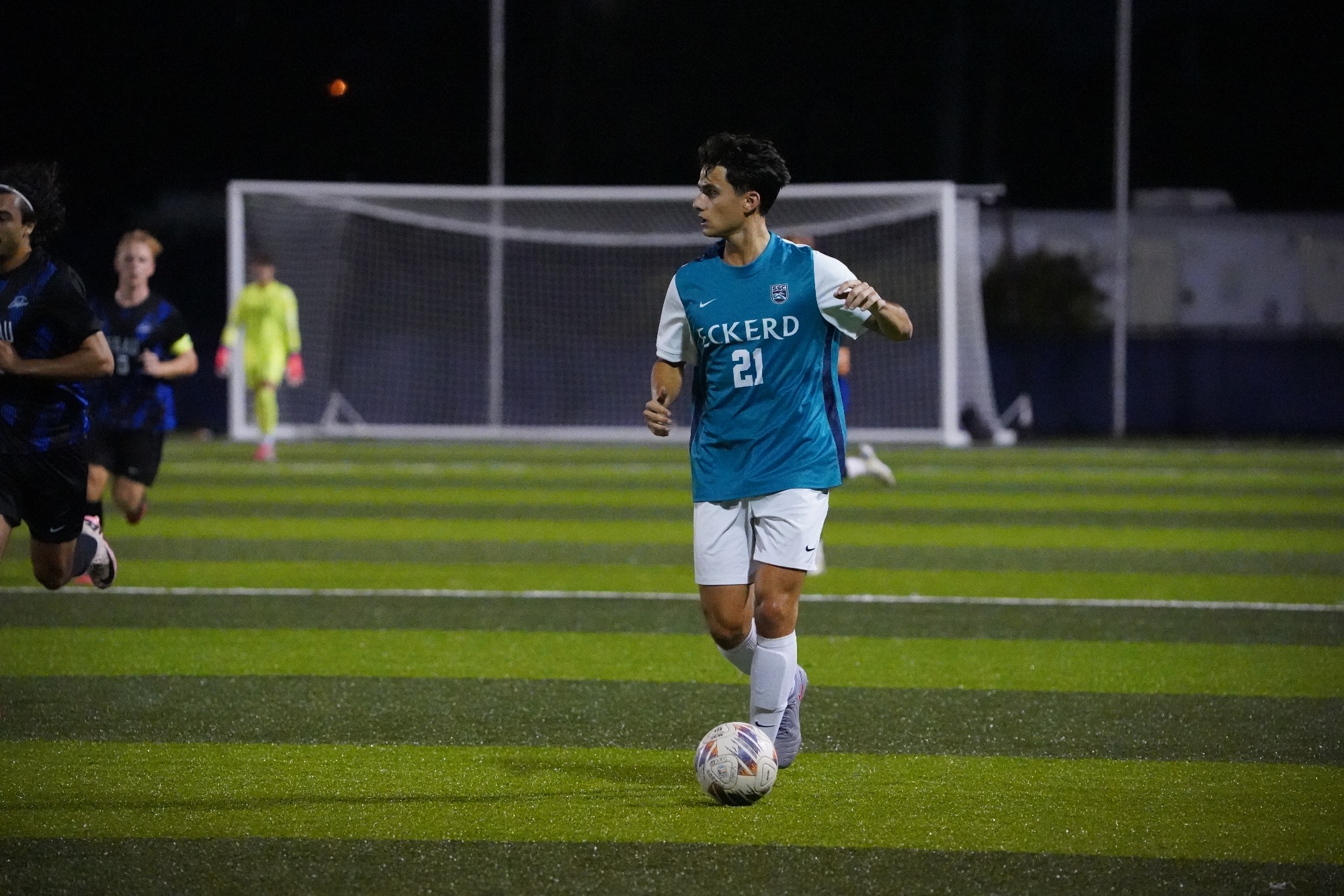 Player dribbles ball upfield