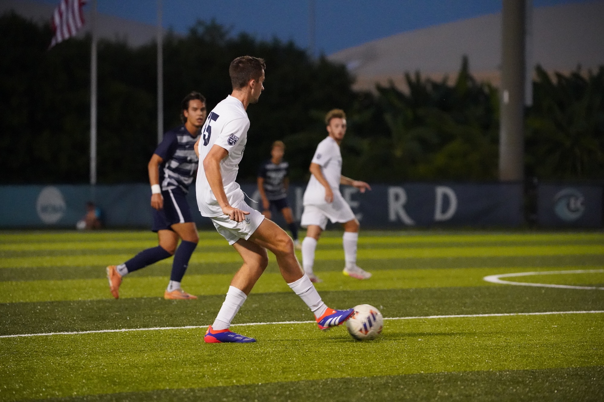 Player begins pass attempt upfield